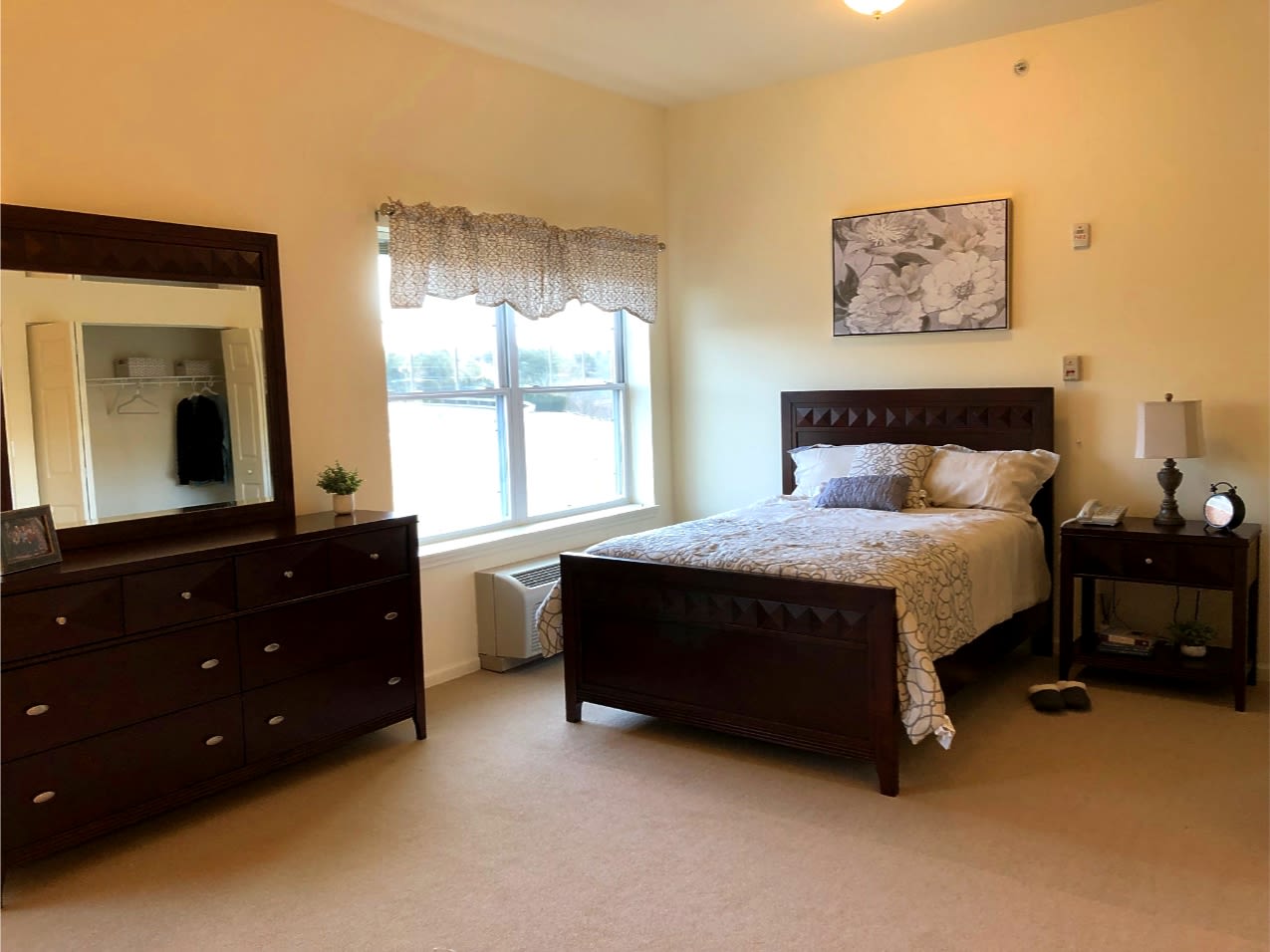 Cozy bedroom with wooden furniture and window